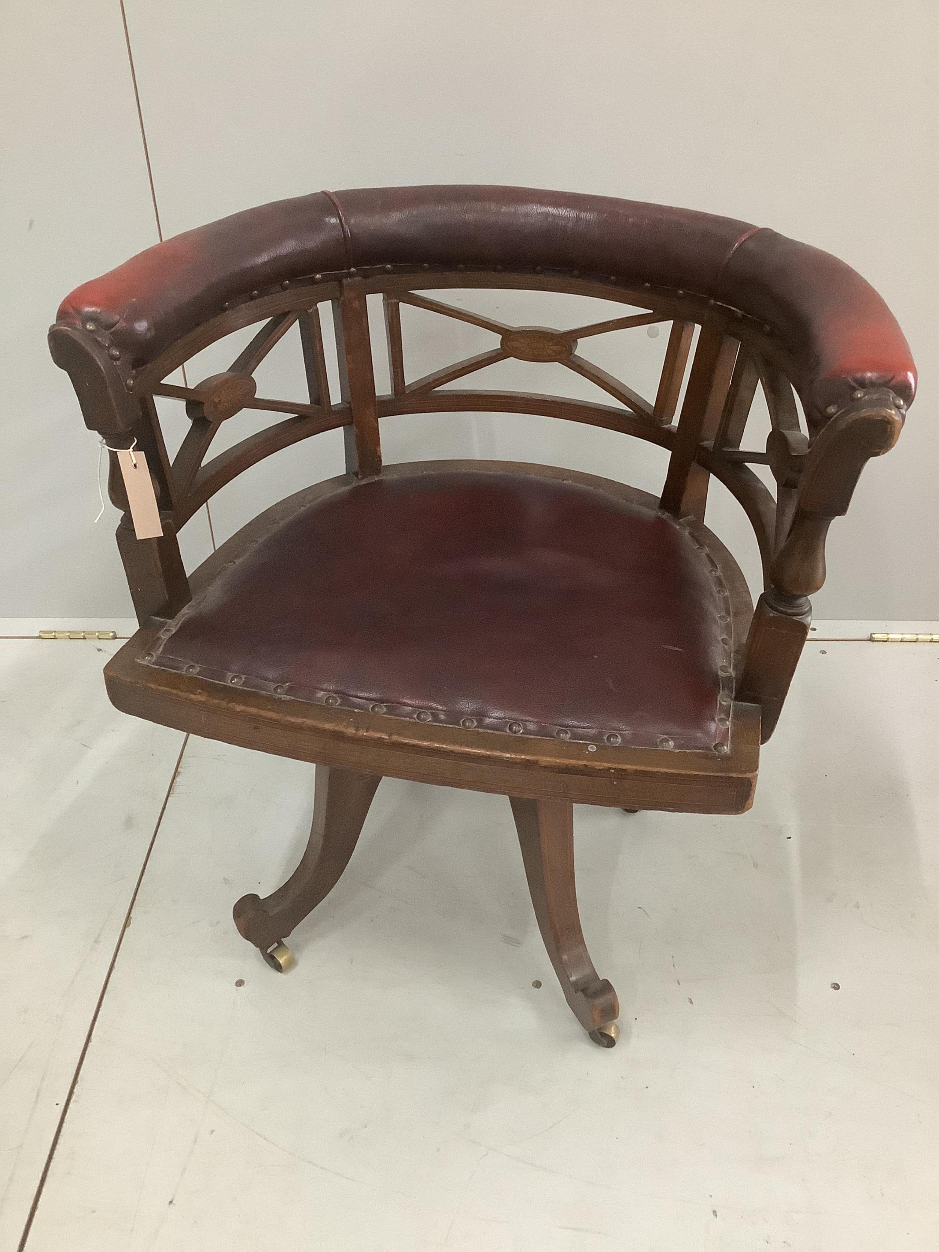 An Edwardian inlaid mahogany leather swivel desk chair, width 65cm, depth 48cm, height 68cm. Condition - poor to fair